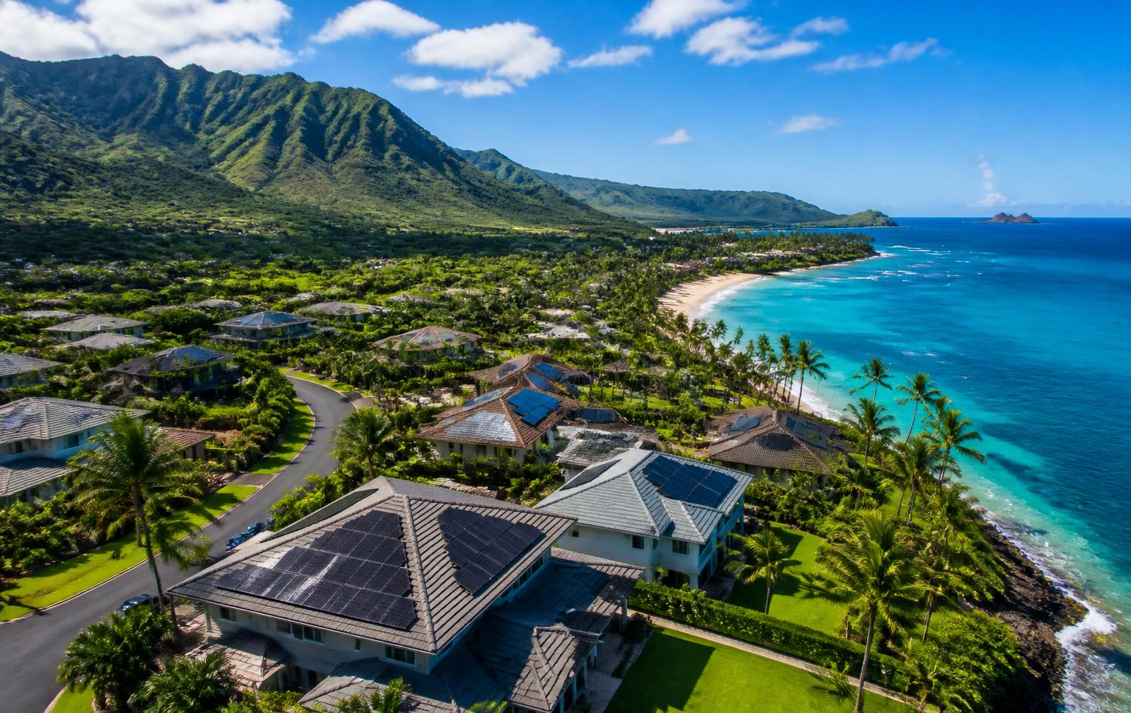 Hawaii coastline with homes, mountains and ocean